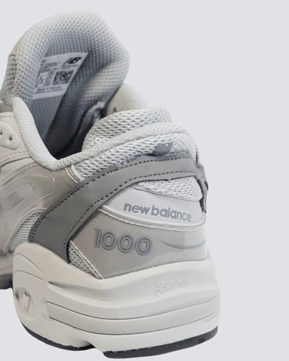 NEW BALANCE 1000 GRIS HOMBRE